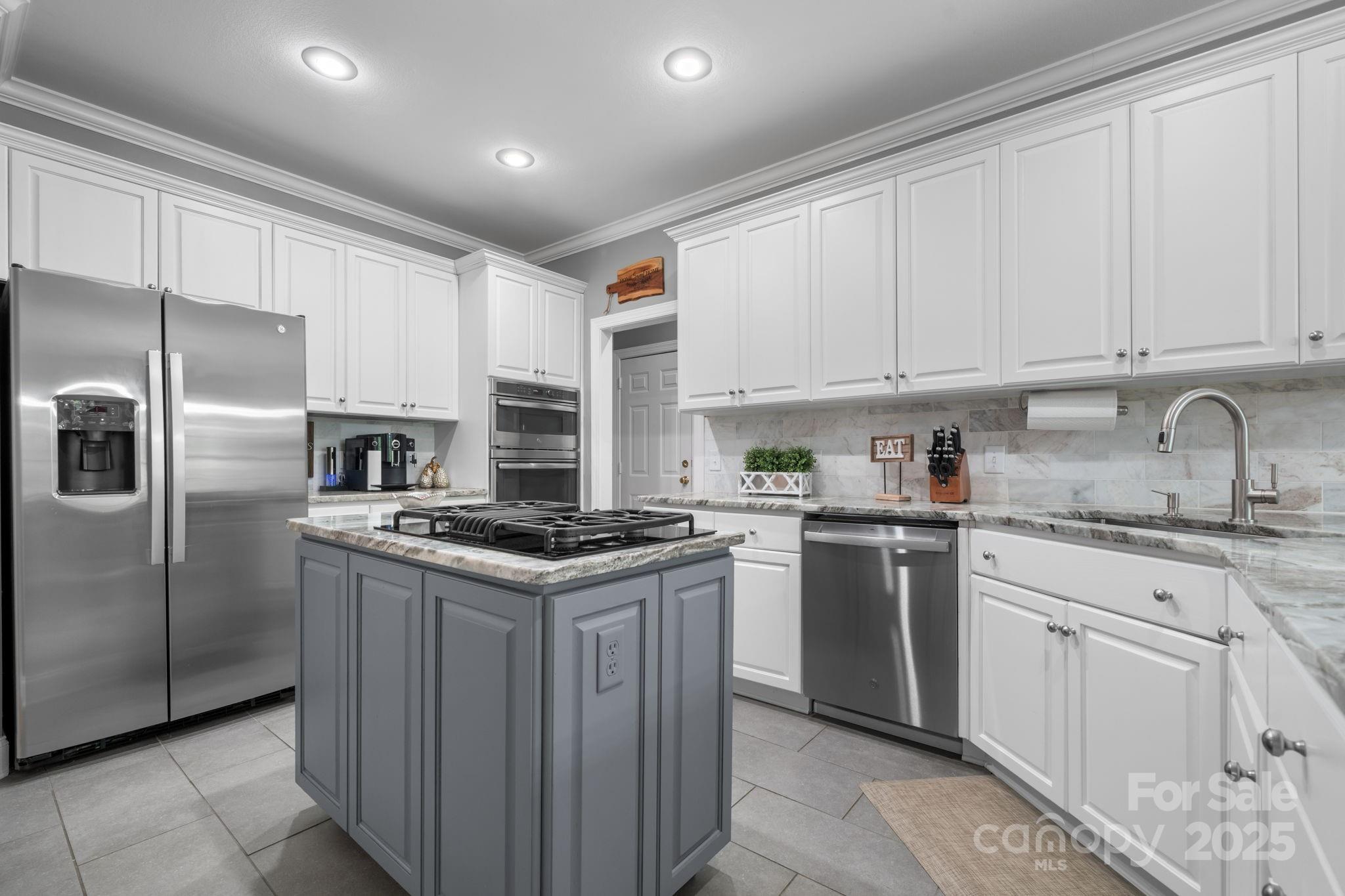 104 Blackhawk Ridge Court Granite Falls, NC 28630 - Photo 14 of 48 a kitchen with granite countertop a sink stove and refrigerator