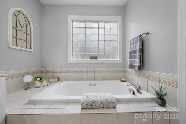 a bathroom with a bathtub and a sink
