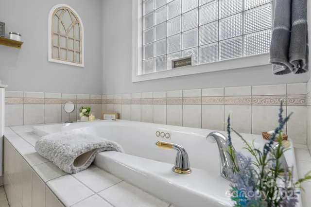 a bathroom with a tub and a sink