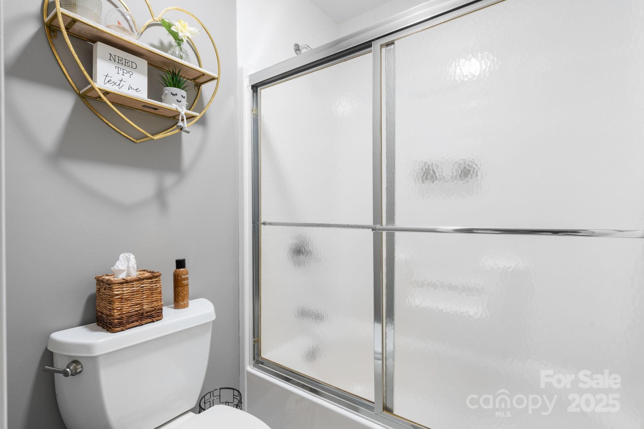 104 Blackhawk Ridge Court Granite Falls, NC 28630 - Photo 28 of 48 a bathroom with a shower a toilet and a sink
