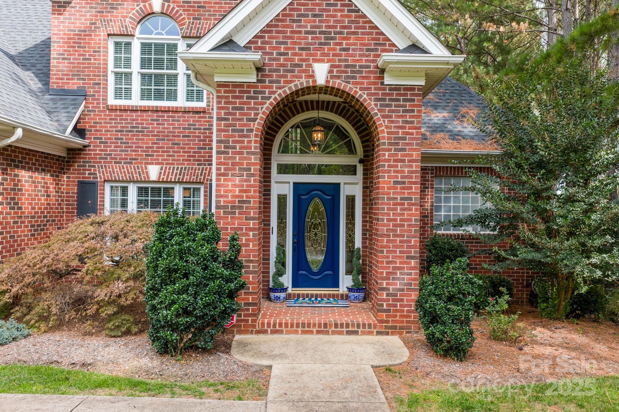104 Blackhawk Ridge Court Granite Falls, NC 28630 - Photo 3 of 48 a view of a brick house with potted plants