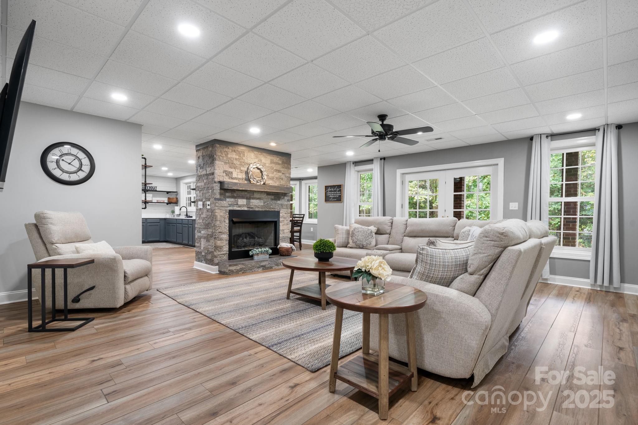 104 Blackhawk Ridge Court Granite Falls, NC 28630 - Photo 34 of 48 a living room with furniture a fireplace and a large window