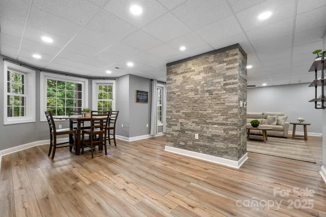 an empty room with wooden floor and furniture