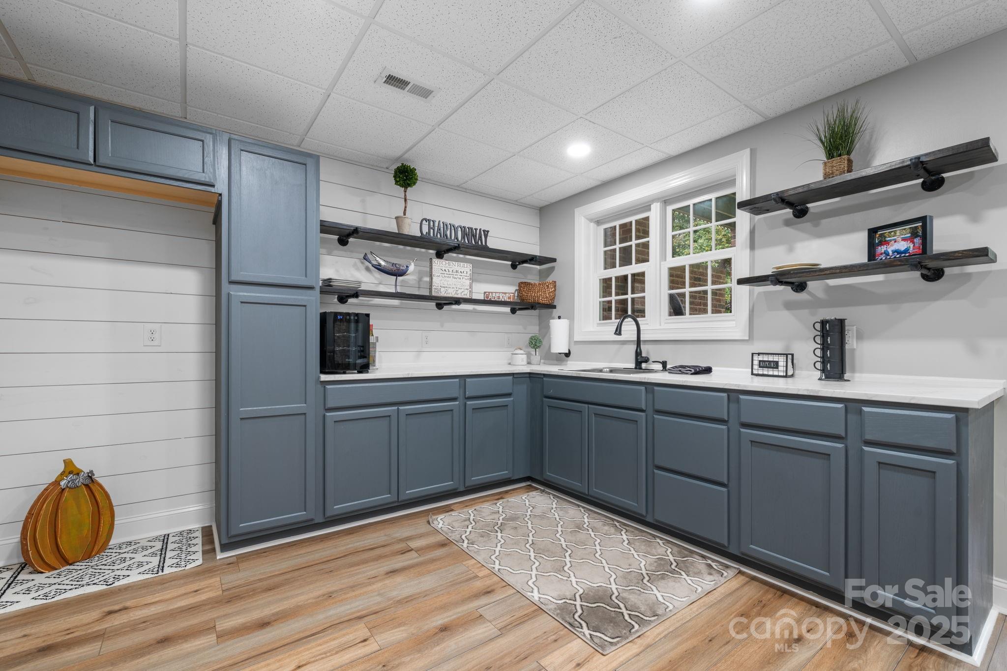 104 Blackhawk Ridge Court Granite Falls, NC 28630 - Photo 39 of 48 a kitchen with sink cabinets and window