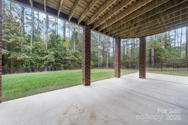 a view of yard with porch and outdoor seating