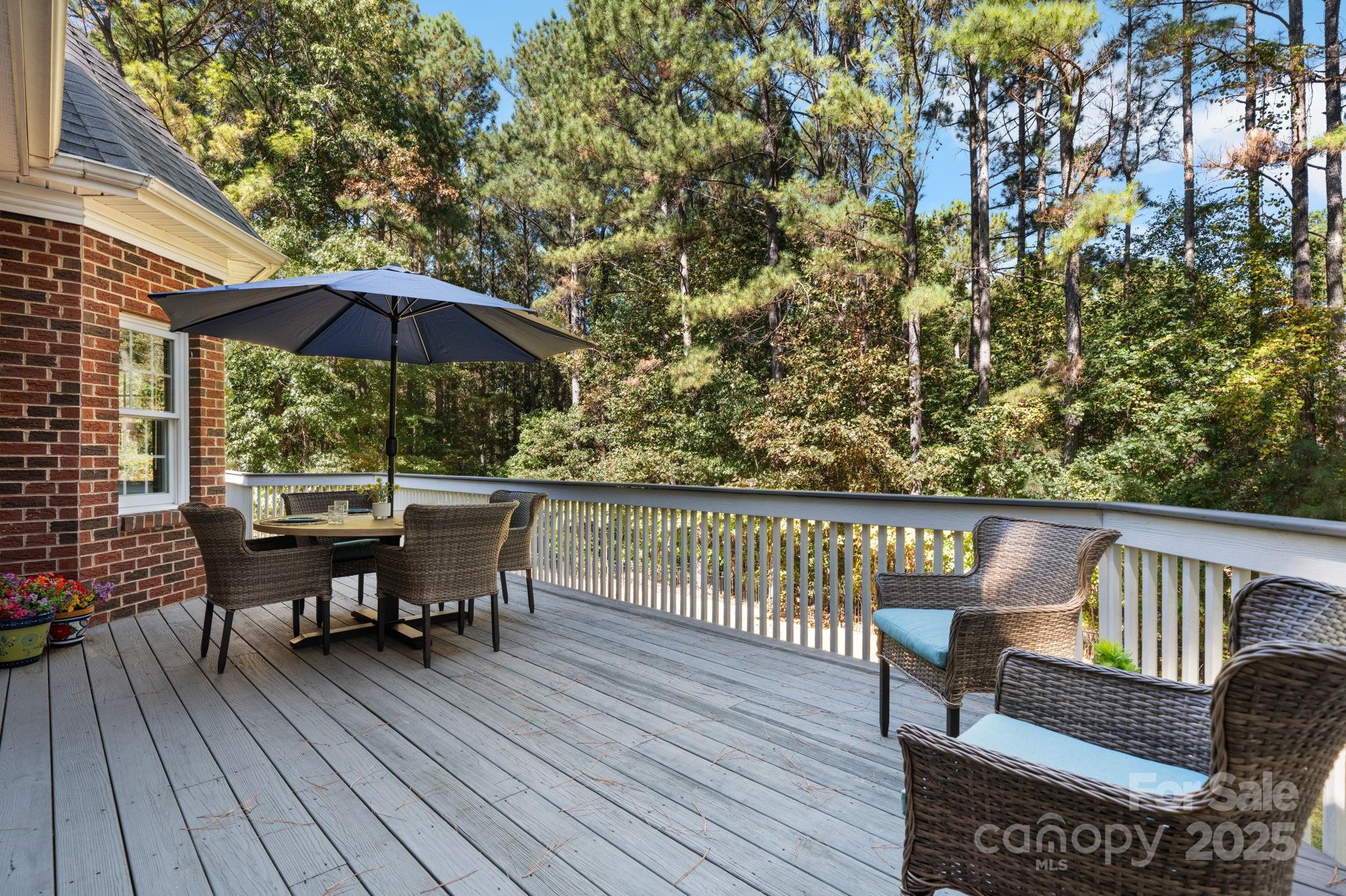 104 Blackhawk Ridge Court Granite Falls, NC 28630 - Photo 44 of 48 a view of a chairs and table on the wooden floor