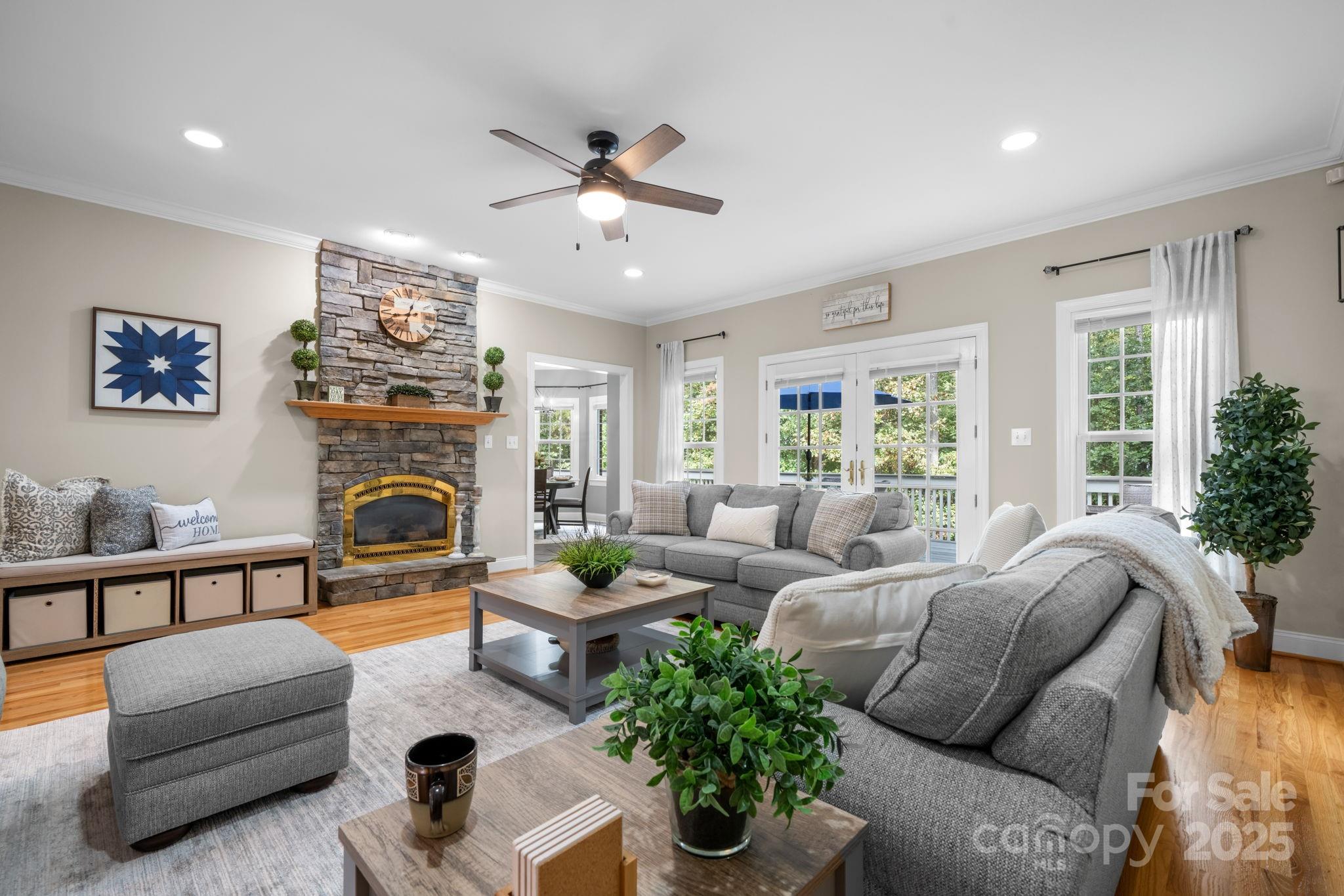 104 Blackhawk Ridge Court Granite Falls, NC 28630 - Photo 8 of 48 a living room with furniture flower pot and a fireplace