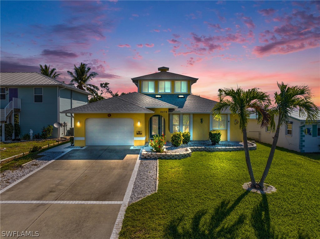 3278 York Road St. James City, FL 33956 - Photo 1 of 49 a view of a house with swimming pool and a yard