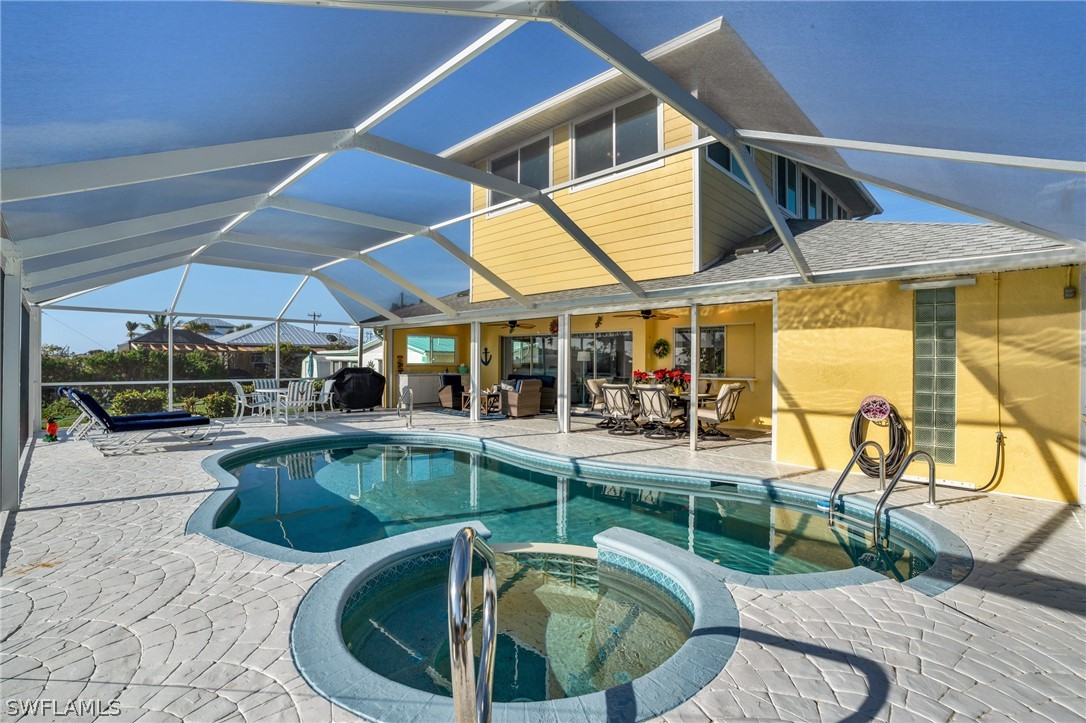 3278 York Road St. James City, FL 33956 - Photo 12 of 49 a view of a swimming pool with a patio