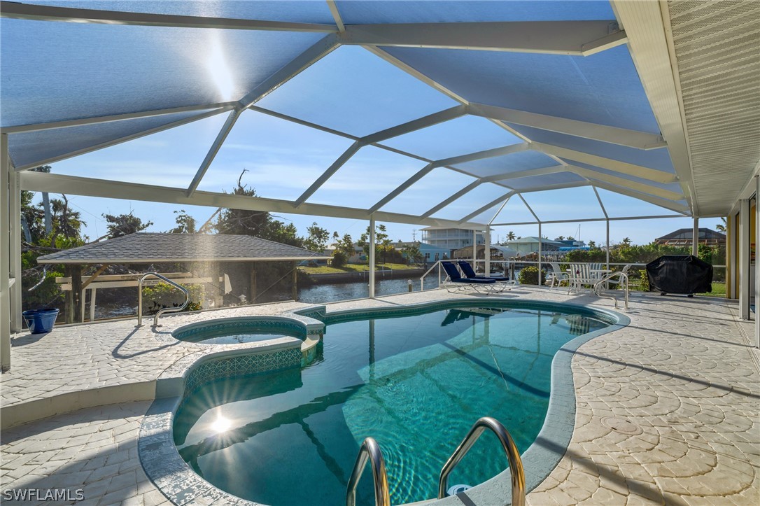 3278 York Road St. James City, FL 33956 - Photo 2 of 49 a view of a swimming pool with a patio
