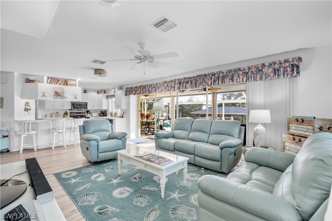 3278 York Road St. James City, FL 33956 - Photo 24 of 49 a living room with furniture and a large window