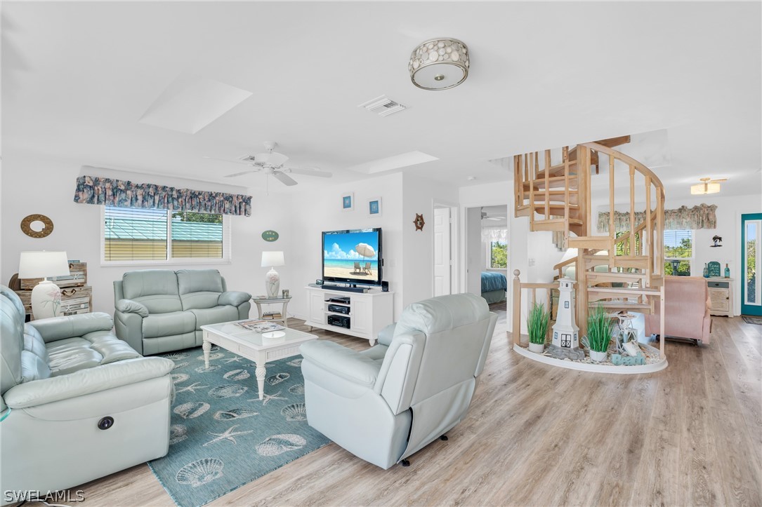 3278 York Road St. James City, FL 33956 - Photo 25 of 49 a living room with furniture and a wooden floor