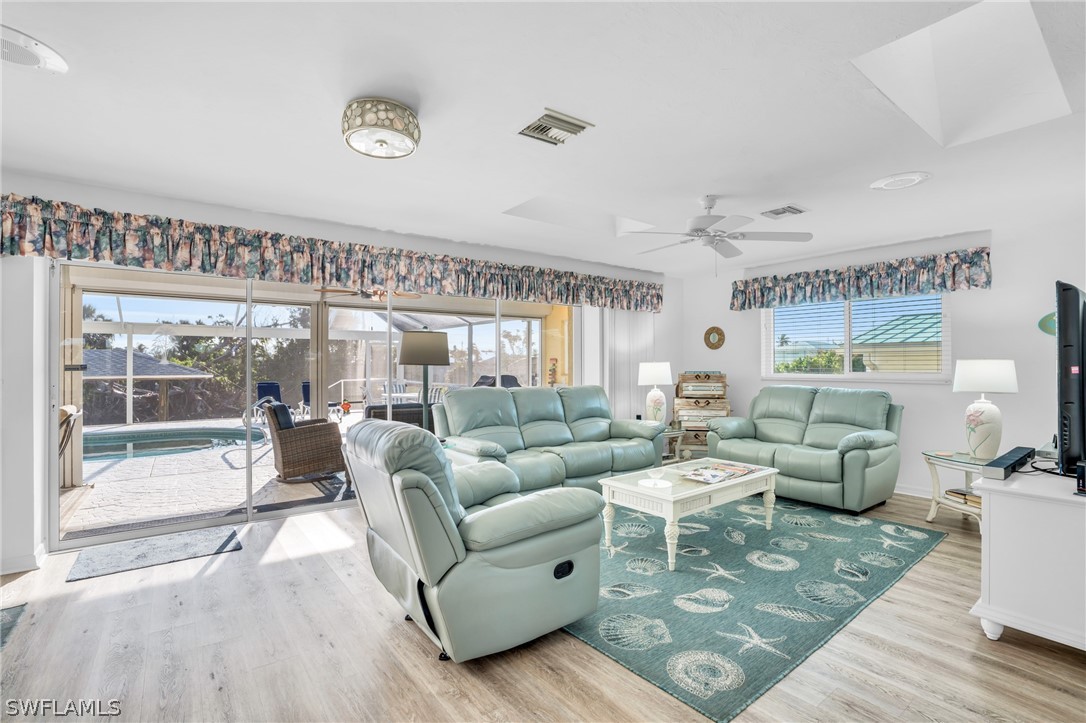 3278 York Road St. James City, FL 33956 - Photo 26 of 49 a living room with furniture and a large window