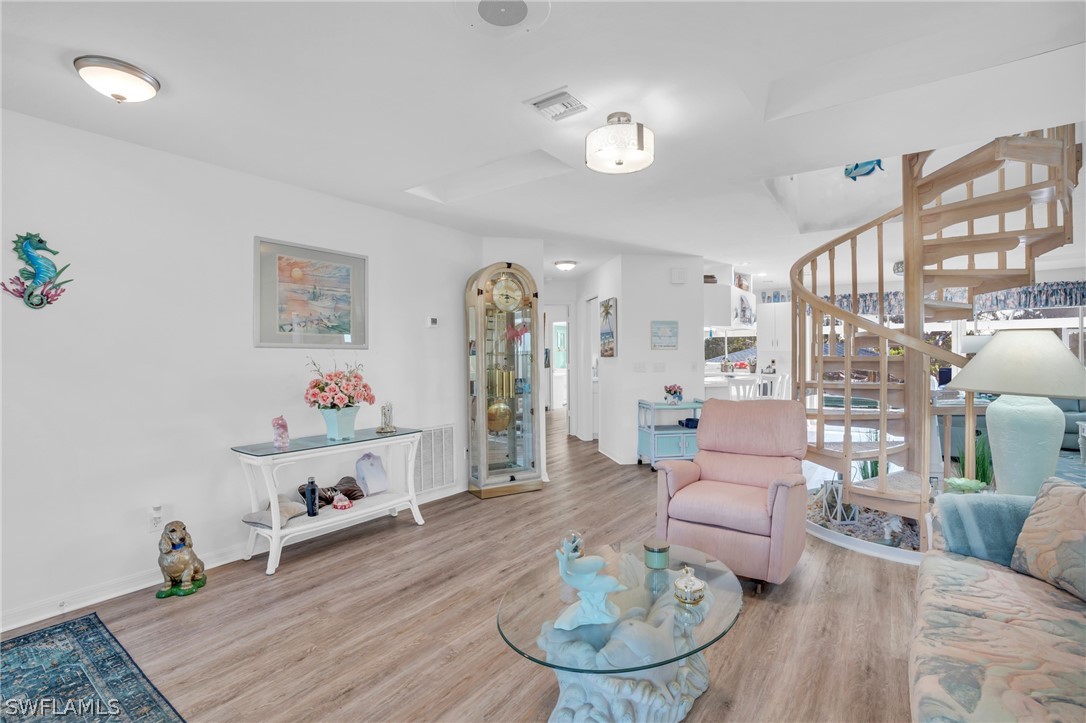3278 York Road St. James City, FL 33956 - Photo 27 of 49 a living room with furniture and wooden floor