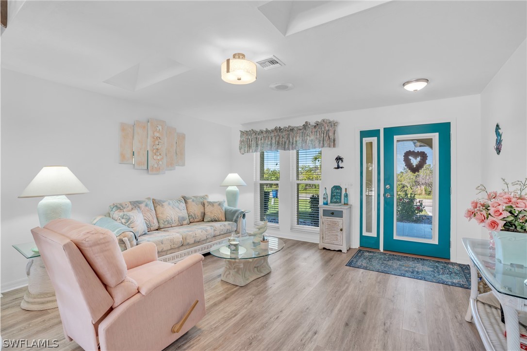 3278 York Road St. James City, FL 33956 - Photo 29 of 49 a living room with furniture and wooden floor