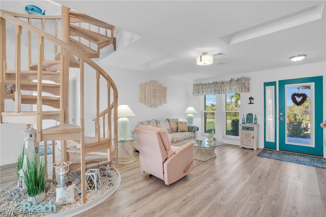 3278 York Road St. James City, FL 33956 - Photo 30 of 49 a living room with furniture large window and wooden floor