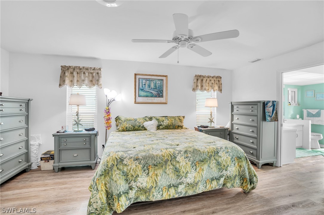 3278 York Road St. James City, FL 33956 - Photo 33 of 49 a bedroom with a bed and a cabinets