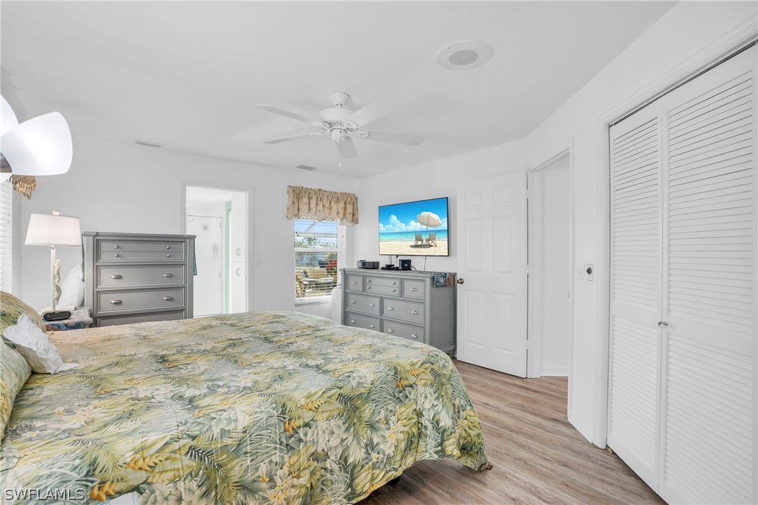 3278 York Road St. James City, FL 33956 - Photo 34 of 49 a bedroom with a bed and a dresser