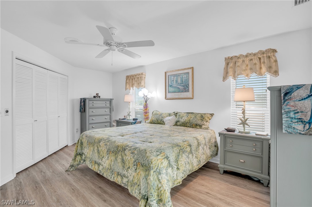 3278 York Road St. James City, FL 33956 - Photo 35 of 49 a bedroom with a bed and wooden floor