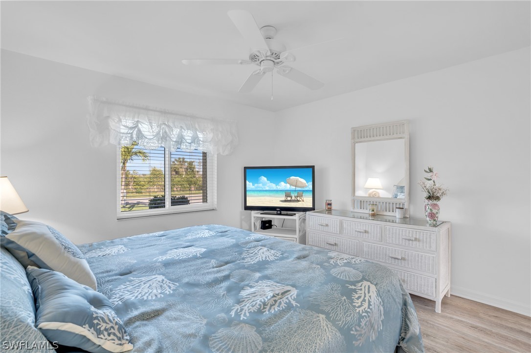 3278 York Road St. James City, FL 33956 - Photo 37 of 49 a bed room with furniture and a flat screen tv