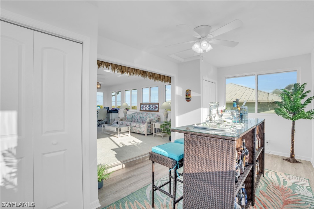 3278 York Road St. James City, FL 33956 - Photo 39 of 49 a view of a dining room with furniture and a chandelier