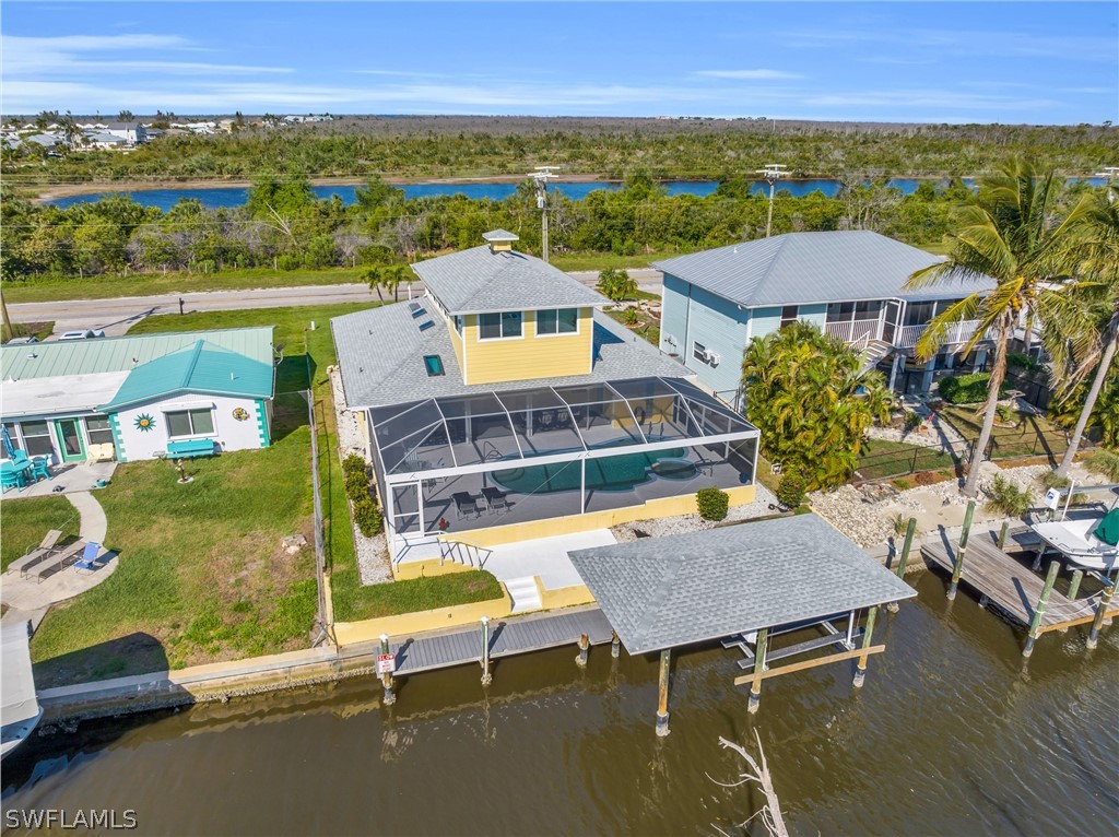 3278 York Road St. James City, FL 33956 - Photo 8 of 49 an aerial view of a house with a ocean view