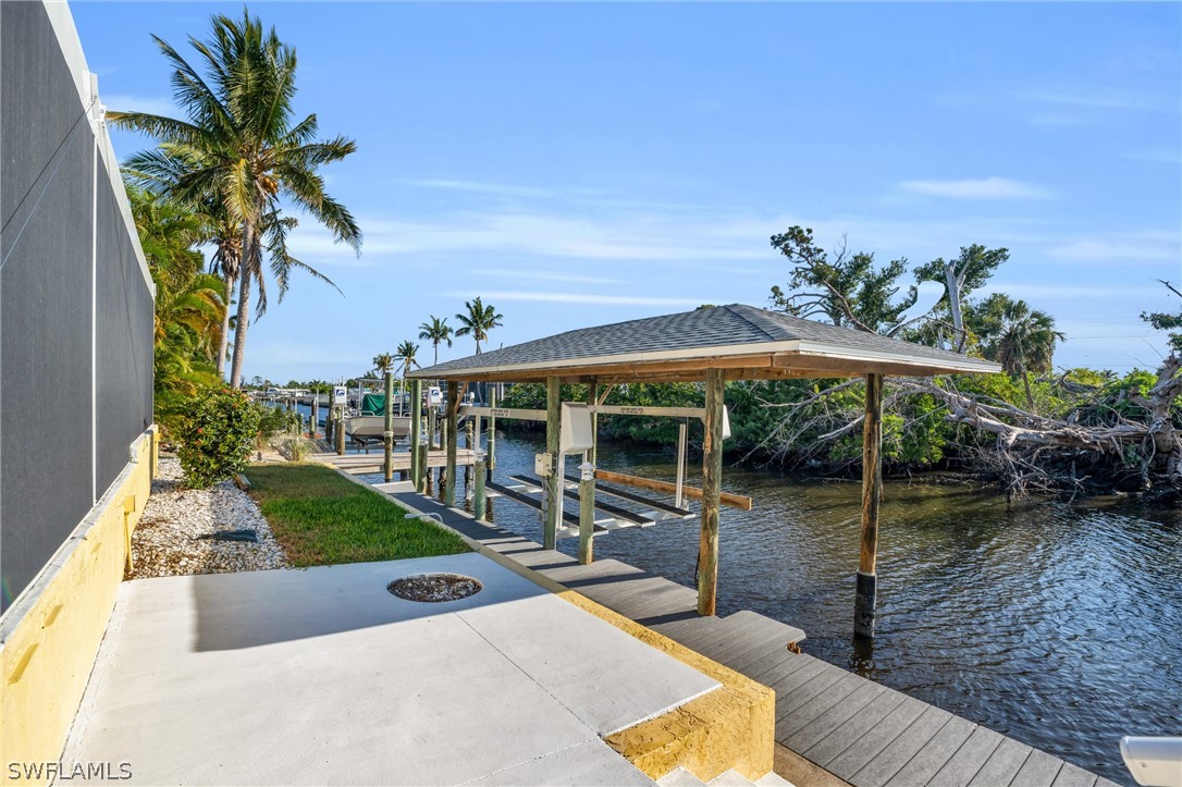 3278 York Road St. James City, FL 33956 - Photo 9 of 49 a view of a swimming pool with a patio