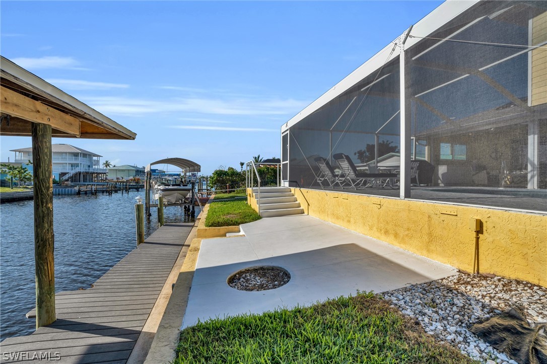 3278 York Road St. James City, FL 33956 - Photo 10 of 49 a view of a swimming pool with a patio