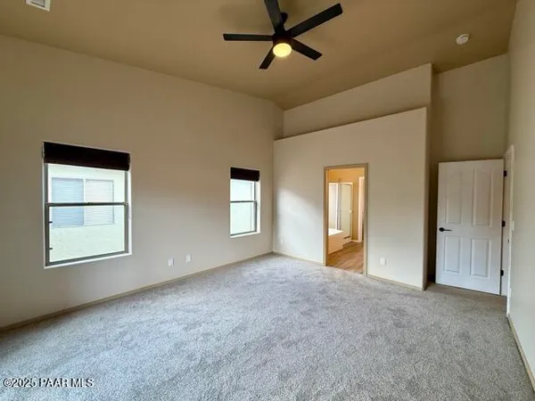 a view of empty room with windows