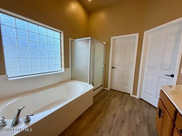 a view of a bathroom with a shower and a toilet