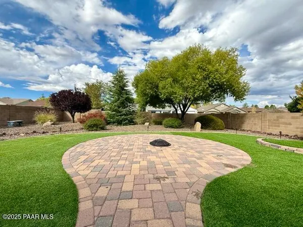 a view of a pathway both side of yard