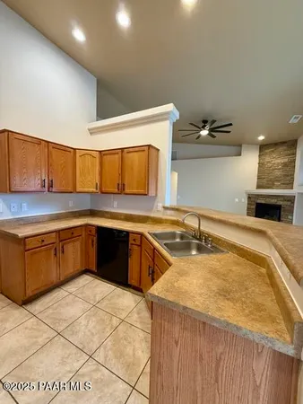 a kitchen with a stove a sink and a microwave