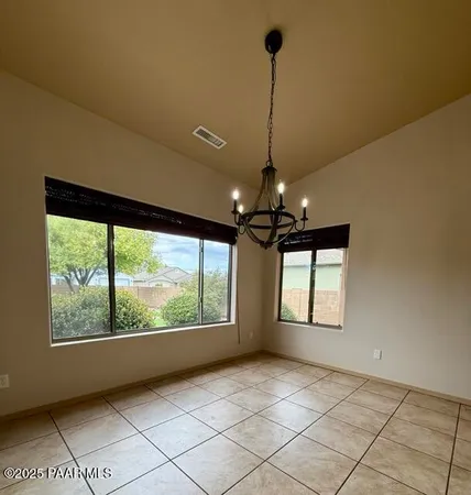 a view of an empty room with windows