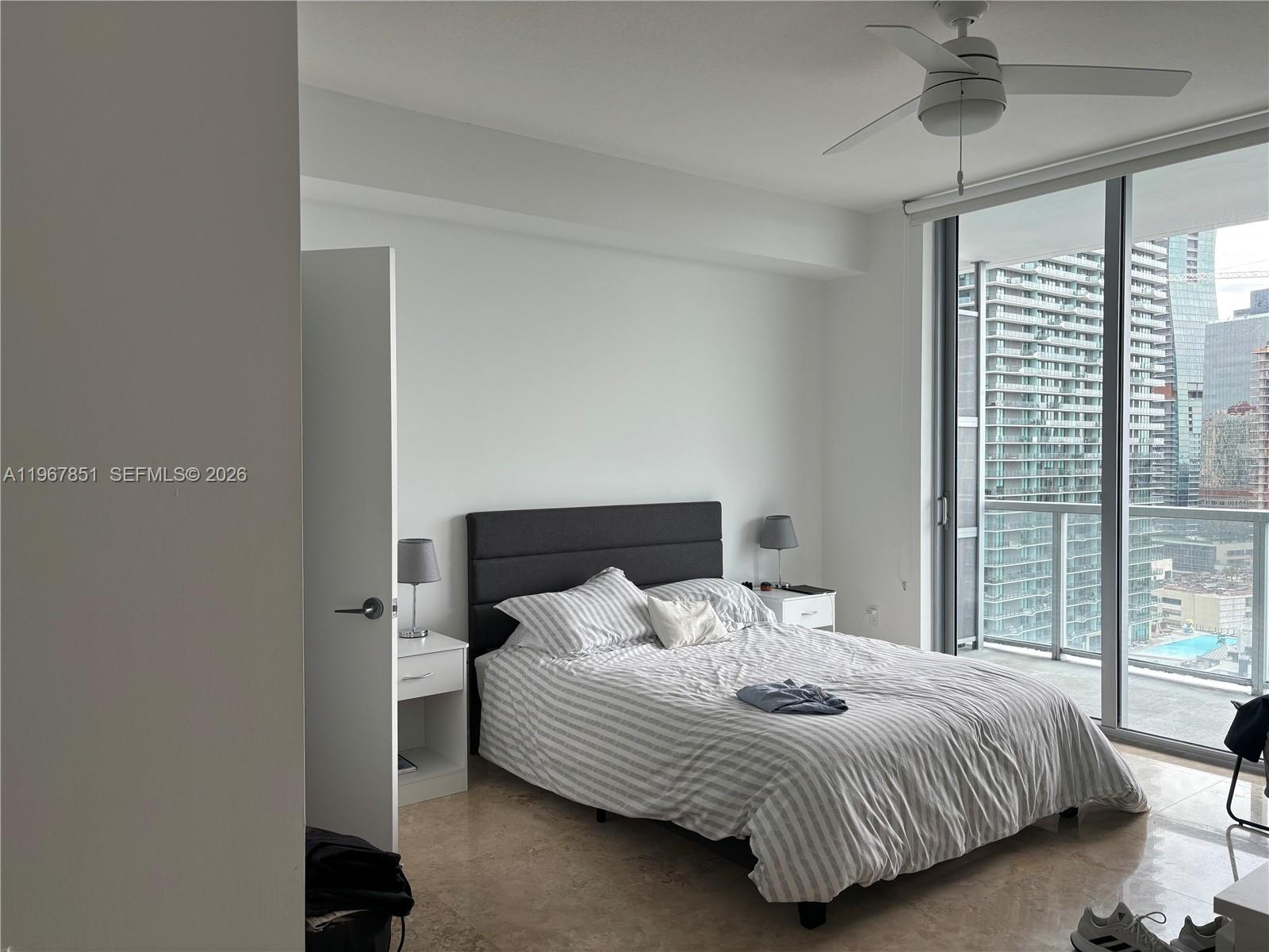 79 Southwest 12th Street, Unit 2703S Miami, FL 33130 - Photo 13 of 61 a bedroom with a bed and window