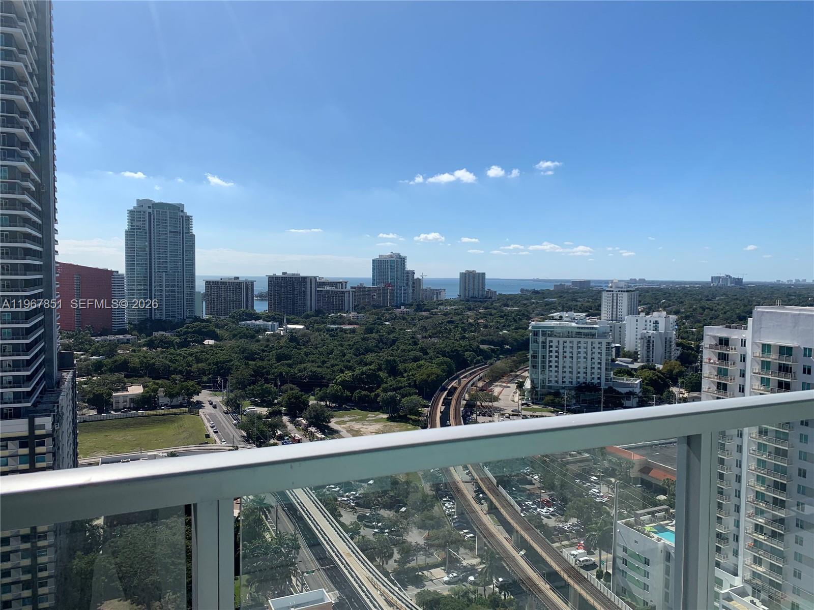 79 Southwest 12th Street, Unit 2703S Miami, FL 33130 - Photo 36 of 61 a view of a city skyline from a balcony