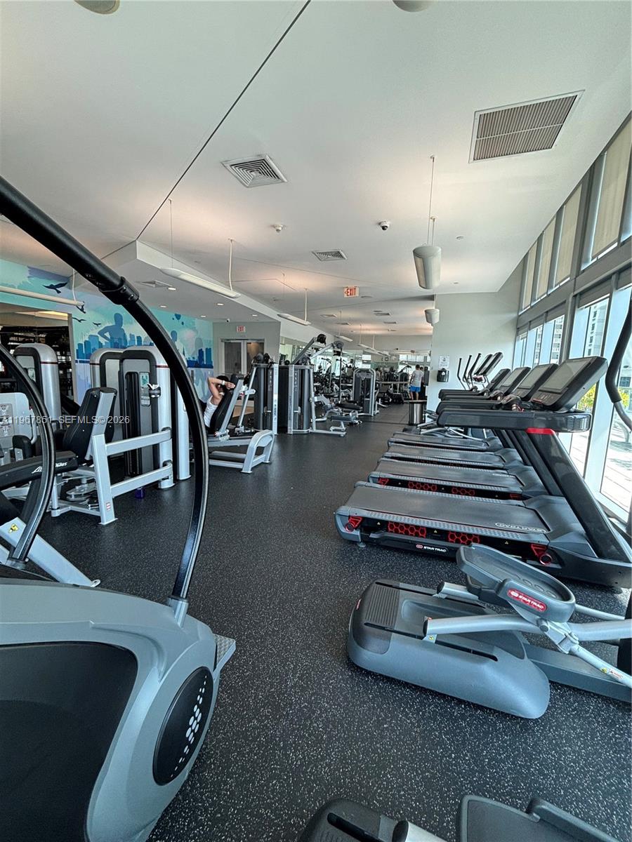 79 Southwest 12th Street, Unit 2703S Miami, FL 33130 - Photo 43 of 61 a gym room with gym equipment