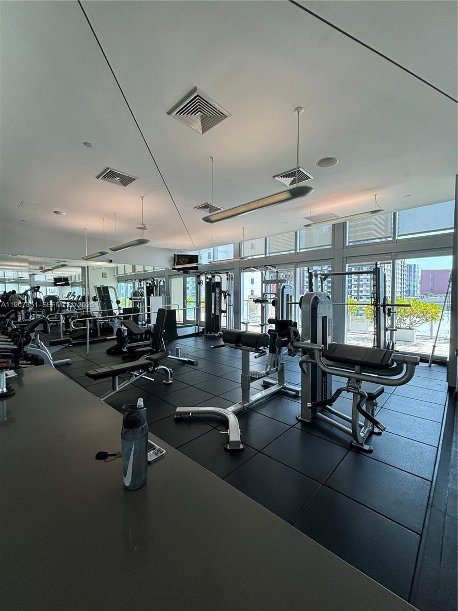 79 Southwest 12th Street, Unit 2703S Miami, FL 33130 - Photo 44 of 61 a view of a room with gym equipment