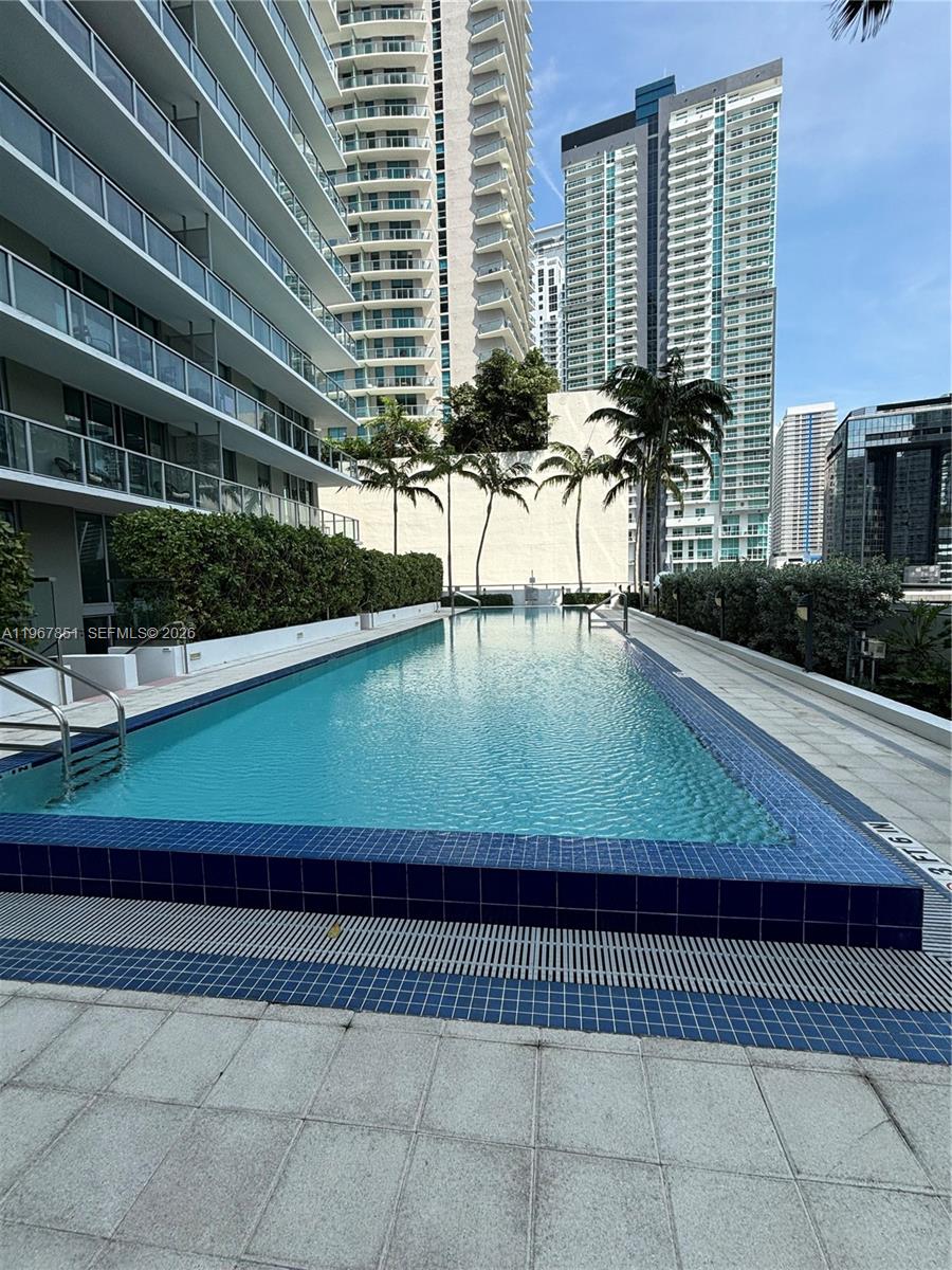 79 Southwest 12th Street, Unit 2703S Miami, FL 33130 - Photo 56 of 61 a view of swimming pool with outdoor seating