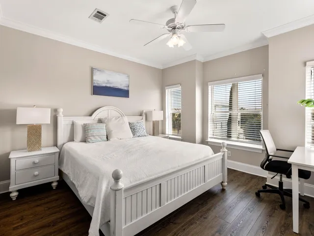 a bedroom with a bed and a table