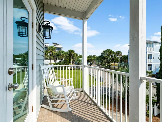 a view of a balcony with lake view and a potted plant