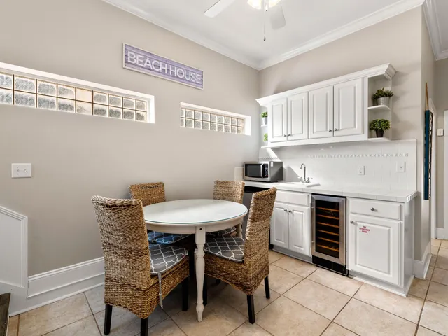 a kitchen with stainless steel appliances granite countertop a white cabinets and a stove