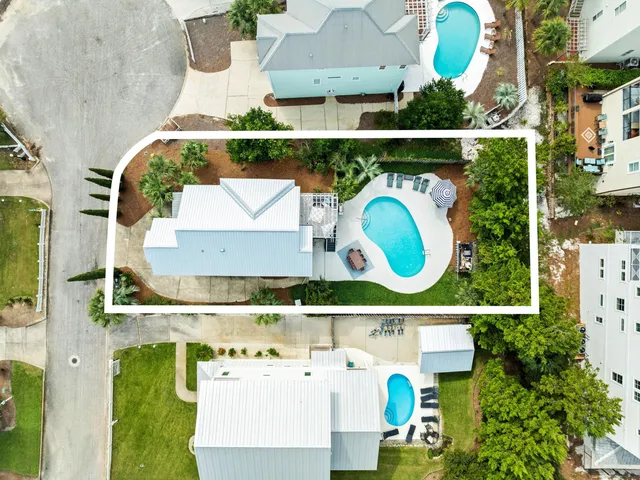 an aerial view of houses with outdoor space