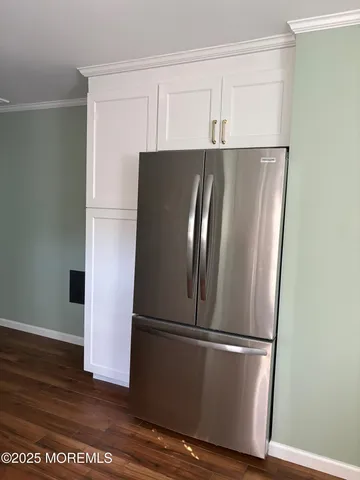 a view of kitchen with wooden floor