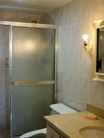 a bathroom with a sink and a shower