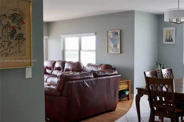 a living room with furniture and window