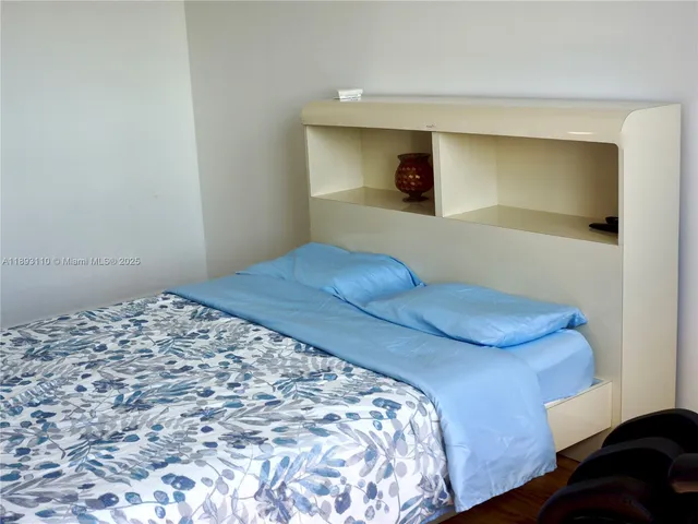 a room with a table chairs and a flat screen tv