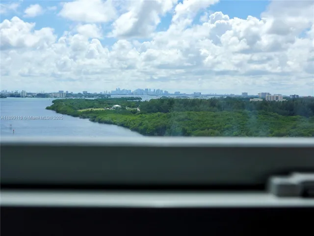 a view of a dining room with furniture and window