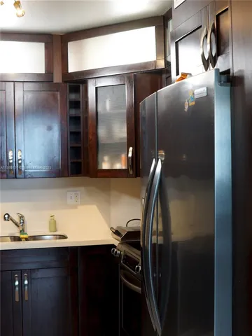 a living room with furniture a large window and a table