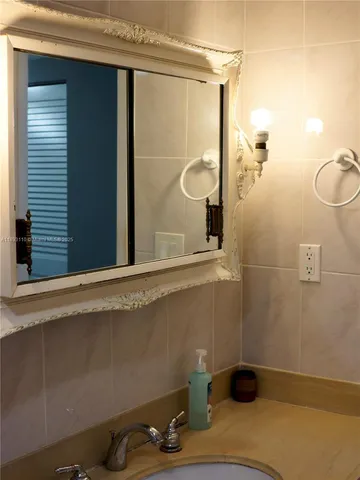 a bathroom with a toilet and a tub