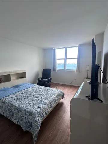 a view of a utility room and empty room